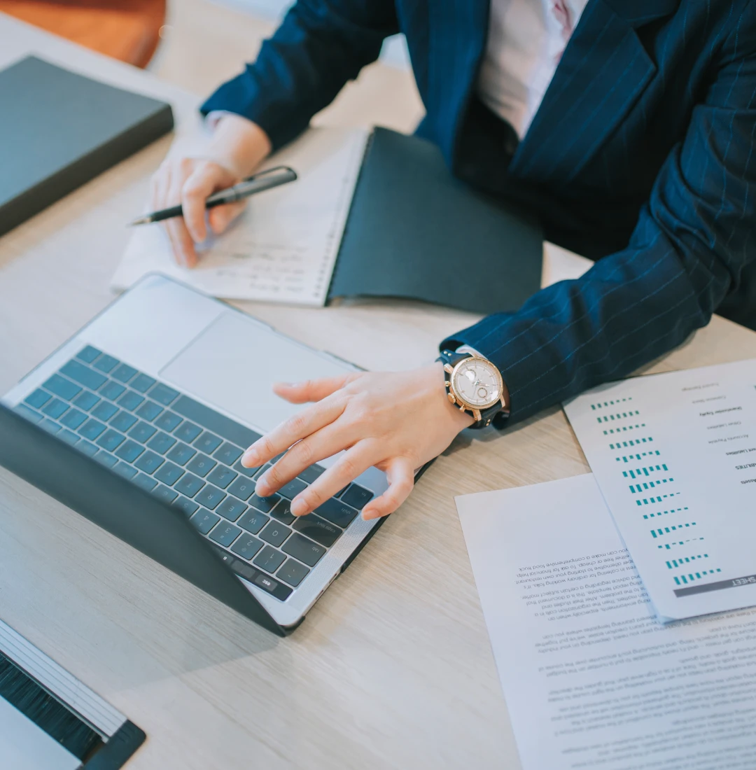 Person taking notes during work meeting