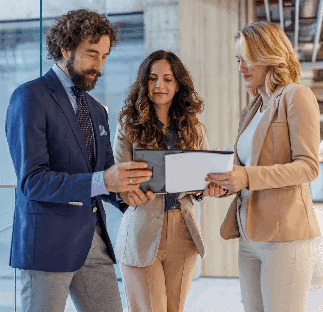 Professionals examining paperwork together