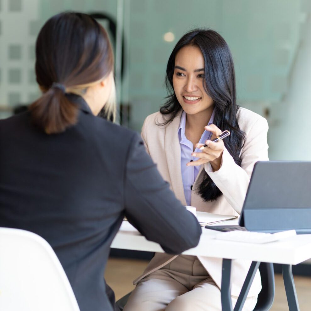 Colleagues engaged in conversation at work